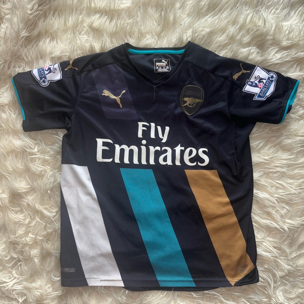 Puma Black Kids' Arsenal Fly Emirates Soccer Jersey with Teal & Gold Stripes